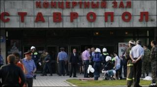 Emergency workers help injured people outside the concert hall in Stavropol, 26 May