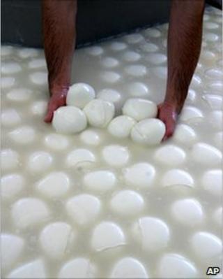 Buffalo mozzarella cheese is prepared at an Italian dairy, file pic