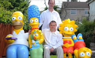 Glyn Stott, partner Roy Culliford and the Simpsons' replicas