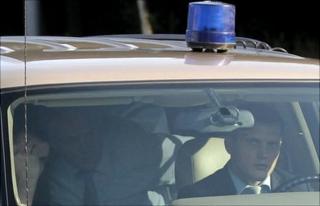 A car believed to contain deported Russian spies leaves Moscow's Domodedovo airport