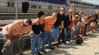 Residents of Laguna Niguel expose their buttocks to a passing Amtrak train