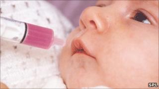 Baby being given liquid paracetamol