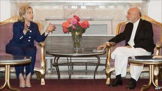 US Secretary of State Hillary Clinton and Afghanistan President Hamid Karzai met privately at the Presidential Palace in Kabul