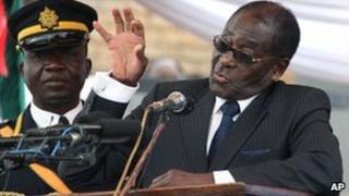 Zimbabwean President Robert Mugabe speaks at his sister's funeral, 1 August