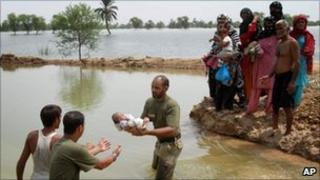 Soldiers help rescue people in Nowshera stranded by flood water in Pakistan