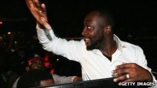Wyclef Jean waves to supporters before the ruling is announced 20 Aug 2010