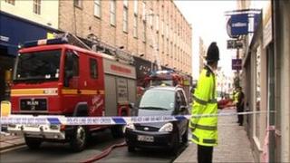 Police and fire service outside New Look in St Helier