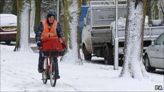 Postman on his bicycle