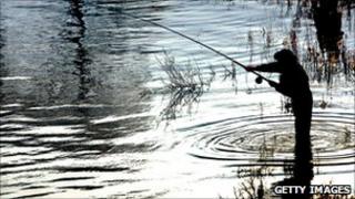 generic pic of angler fishing for salmon