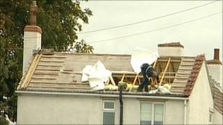 Royden Toon removing roof tiles