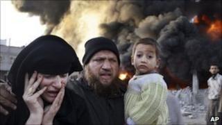 Palestinians flee from an Israeli air strike in Gaza, Dec 2008