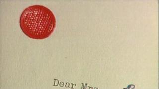 letter with red spot