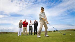 Prestatyn club's professional, David Ames, watched by Carole Startin and David Ames from the Tourism Partnership, Roger Lewis, President of the club, and Nick Kitchen, North Wales Golf Club