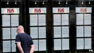 A man looks in the window of a jobs centre in Dublin