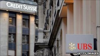 Logos of UBS and Credit Suisse on buildings in Geneva