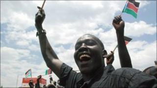 Southern Sudanese in the capital Juba, waving flags to welcome home their leader recently
