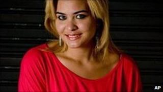 Geisy Arruda poses at home in Sao Paulo wearing the dress for which she had earlier been expelled from Bandeirante University, 7 November 2009
