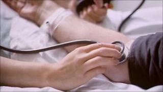 Doctor taking blood pressure