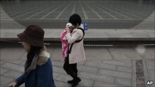 Woman with child in Beijing
