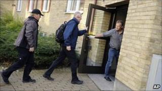 Police arrive to search the suspect's address in Malmo, 7 November