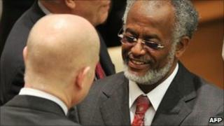 Sudan's Foreign Minister Ali Ahmed Karti (R) shakes hands with British Foreign Secretary William Hague