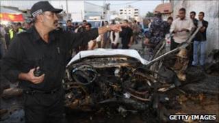 A Palestinian security official at the scene of the attack