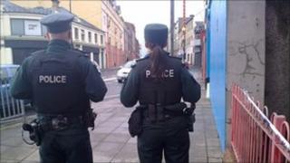 The police are at the scene of the attack in John Street