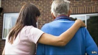Care worker and elderly man