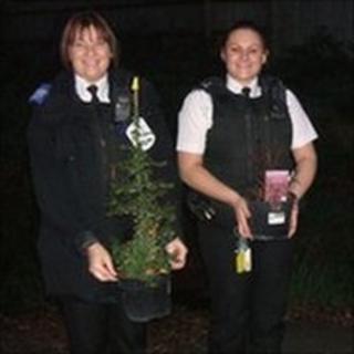 Police officers with plants