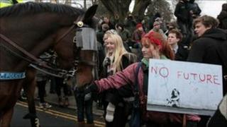 Student protester and police horse