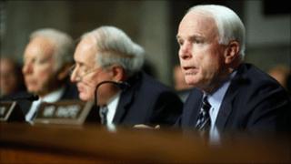 Senator John McCain, foreground, Senator Carl Levine, middle, and Senator Joseph Lieberman