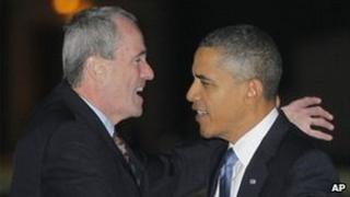 US Ambassador Philip Murphy (left) greets Barack Obama when the US president stops off at Ramstein Air Base in Germany for a refuelling stop, 5 November