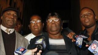 Edna Glover (centre), mother of Henry Glover