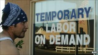 Unemployed man in California reading a job notice