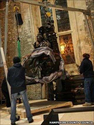 Statue being winched