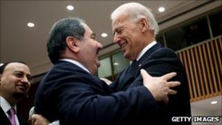 US Vice President Joe Biden (right) hugs Iraqi Foreign Minister Zebari (centre) before the start of a high-level UN Security Council meeting, New York, 15 December 2010