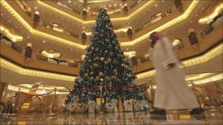 A jewel-encrusted Christmas tree adorns the lobby of the Emirates Palace hotel in Abu Dhabi, the UAE