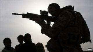 British soldier in Iraq alongside civilians