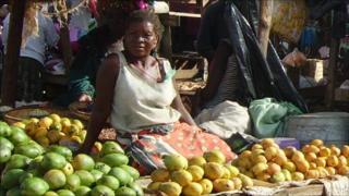 woman selling fruit at market