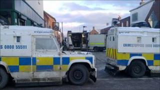 Police vehicles block off the area around Stratheden Street