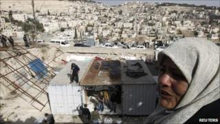 Palestinians take apart their makeshift home in the East Jerusalem neighbourhood of Ras al-Ammoud, 21 December