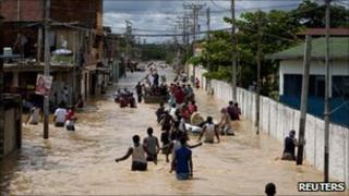 People evacuating homes in Higuerote, Venezuela, on 5 December 2010.