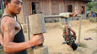 Maoist combatants exercise during physical training hours in Shaktikhor camp in Chitwan, 80km south-west of Kathmandu