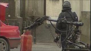 ATO officer and bomb-disposal robot