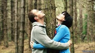 Couple hugging a tree