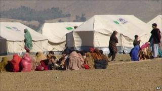 In this photo taken on Jan. 31, 2011 Pakistani displaced people arrived at a camp set up in Naghi, 18 kilometers (11 miles) northwest of the Afghanistan border in the Pakistani tribal area of Mohmand