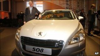 A Peugeot executive shows off the new 508