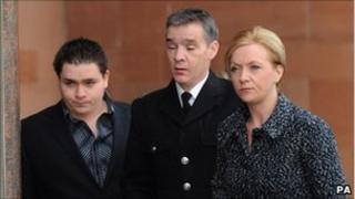 Pc David Rathband arrives at court with his wife and son