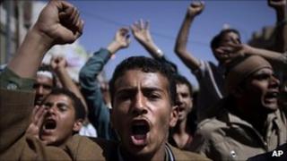 Anti-government protesters chant slogans during a demonstration in Sanaa, Yemen, 23 February 2011