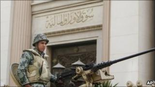 A soldier guards the Egyptian Stock Exchange Market